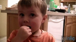 Kid eats atomic warhead candy photo warhead.gif